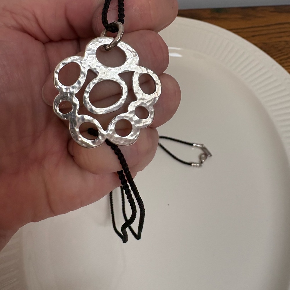 Ippolita Sterling silver 925 pendant & clasp with black silk braided cord.